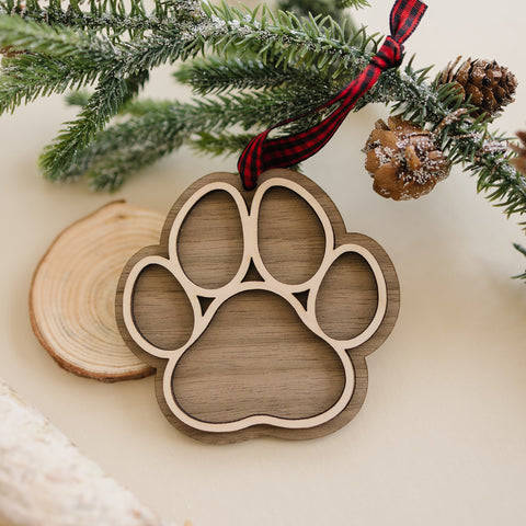 Adorable Personalized Dog Paw Ornament - Cherish your furry friend with this customized ornament featuring a cute paw print. Add your dog's name for a truly special keepsake, perfect for celebrating the joy your pet brings to your holiday season.
