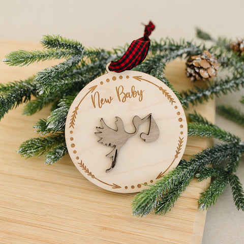 Embrace the joy of Baby's First Christmas with our delightful Stork Ornament. This charming keepsake, intricately designed, is the perfect addition to commemorate this special milestone.