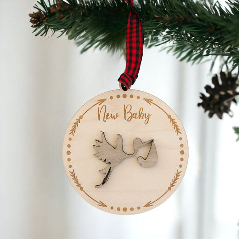 Embrace the joy of Baby's First Christmas with our delightful Stork Ornament. This charming keepsake, intricately designed, is the perfect addition to commemorate this special milestone.