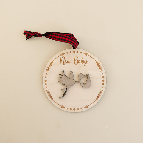 Embrace the joy of Baby's First Christmas with our delightful Stork Ornament. This charming keepsake, intricately designed, is the perfect addition to commemorate this special milestone.