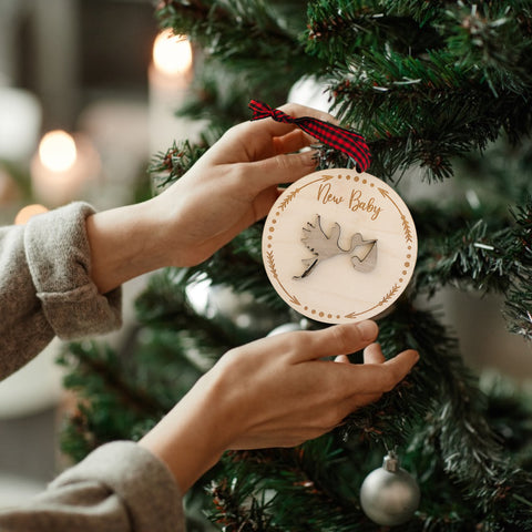 Embrace the joy of Baby's First Christmas with our delightful Stork Ornament. This charming keepsake, intricately designed, is the perfect addition to commemorate this special milestone.
