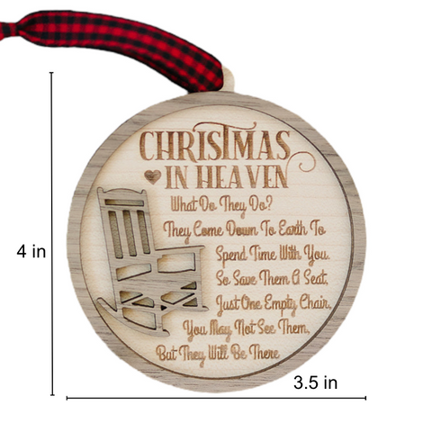 Officially licensed Christmas in Heaven memorial wooden ornament by John F Connor, featuring a poignant chair design with the iconic 'Christmas in Heaven' poem. A heartfelt remembrance gift for the holiday season, this maple and walnut ornament can be personalized on the back with any name or phrase. Versatile for use as a tree ornament or a year-round display, it serves as a touching sympathy gift, preserving cherished memories with enduring grace.