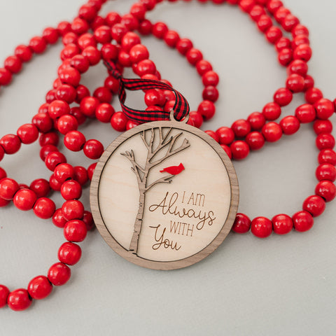 Cardinal memorial wooden ornament, adorned with the heartfelt phrase 'I am always with you,' creating a touching tribute to celebrate everlasting love and cherished memories. The ornament can be personalized on the back with any name or phrase.
