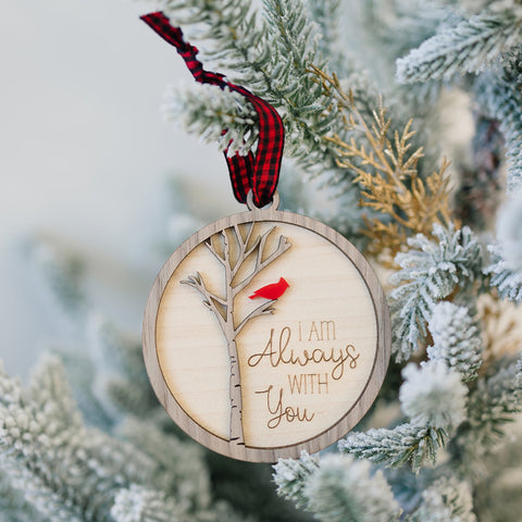 Cardinal memorial wooden ornament, adorned with the heartfelt phrase 'I am always with you,' creating a touching tribute to celebrate everlasting love and cherished memories. The ornament can be personalized on the back with any name or phrase.