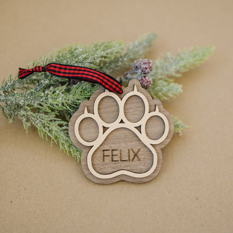 Sweet and Personalized Cat Paw Ornament - Adorn your tree with this delightful ornament featuring a cute cat paw print. Customize it with your cat's name for a unique touch, celebrating the feline charm that brightens your holiday season