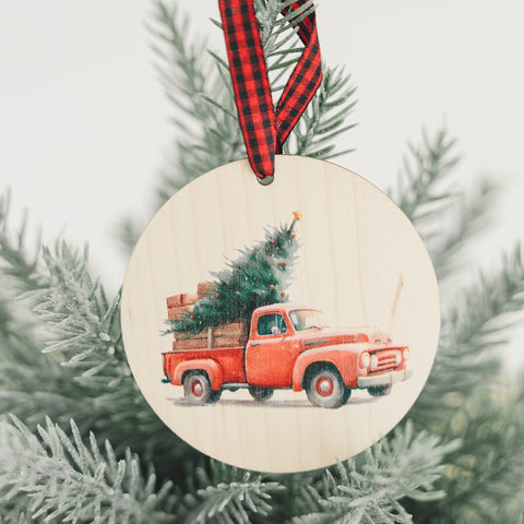 Charming Christmas tree truck ornament, capturing the festive spirit of the season. Adorned with a nostalgic truck hauling a beautifully decorated tree, this delightful ornament adds a touch of holiday magic to your decorations.