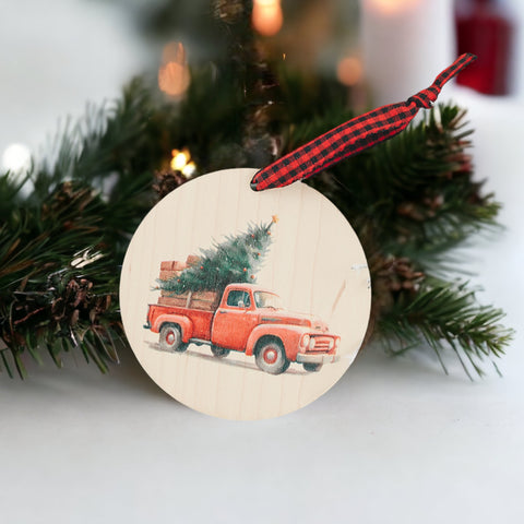 Charming Christmas tree truck ornament, capturing the festive spirit of the season. Adorned with a nostalgic truck hauling a beautifully decorated tree, this delightful ornament adds a touch of holiday magic to your decorations.