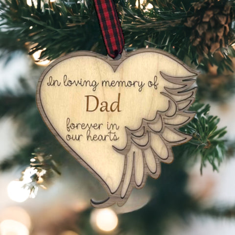 Customized memorial ornament, a touching tribute to Dad. Crafted with care, this personalized keepsake captures the essence of his love and enduring presence, offering a meaningful remembrance during the holiday season.