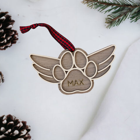 Gentle tribute with the Dog Paw Personalized Memorial Ornament - A loving remembrance for your cherished canine friend. Personalize with your dog's name, creating a special ornament to honor their memory during the holiday season.