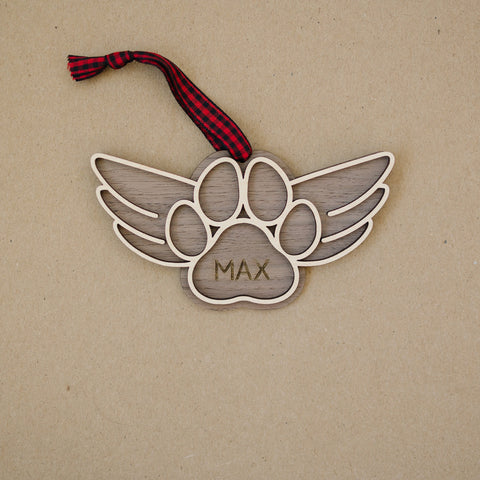 Gentle tribute with the Dog Paw Personalized Memorial Ornament - A loving remembrance for your cherished canine friend. Personalize with your dog's name, creating a special ornament to honor their memory during the holiday season.