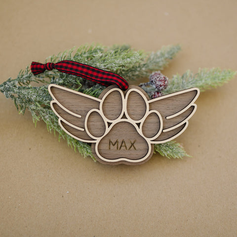 Gentle tribute with the Dog Paw Personalized Memorial Ornament - A loving remembrance for your cherished canine friend. Personalize with your dog's name, creating a special ornament to honor their memory during the holiday season.