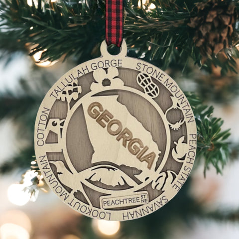 Radiate Southern charm with our Georgia State Highlights Ornament – a delightful keepsake adorned with iconic landmarks and symbols. From historic sites to lush landscapes, this ornament captures the heart and soul of Georgia. Add a touch of southern elegance to your holiday decor with this beautiful piece, celebrating the Peach State in all its glory.