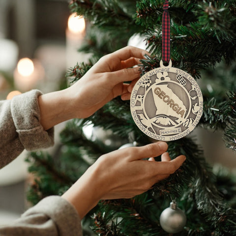 Radiate Southern charm with our Georgia State Highlights Ornament – a delightful keepsake adorned with iconic landmarks and symbols. From historic sites to lush landscapes, this ornament captures the heart and soul of Georgia. Add a touch of southern elegance to your holiday decor with this beautiful piece, celebrating the Peach State in all its glory.