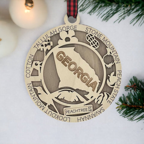 Radiate Southern charm with our Georgia State Highlights Ornament – a delightful keepsake adorned with iconic landmarks and symbols. From historic sites to lush landscapes, this ornament captures the heart and soul of Georgia. Add a touch of southern elegance to your holiday decor with this beautiful piece, celebrating the Peach State in all its glory.