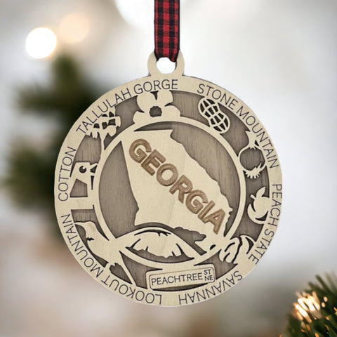 Radiate Southern charm with our Georgia State Highlights Ornament – a delightful keepsake adorned with iconic landmarks and symbols. From historic sites to lush landscapes, this ornament captures the heart and soul of Georgia. Add a touch of southern elegance to your holiday decor with this beautiful piece, celebrating the Peach State in all its glory.