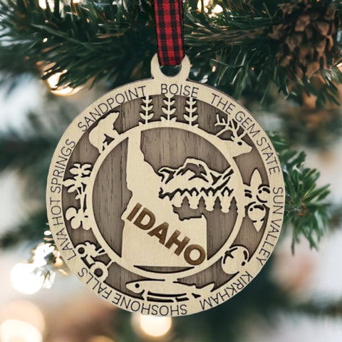 Adorn your tree with the charm of Idaho! Our Idaho State Highlights Ornament showcases the beauty of the Gem State. From rugged mountains to scenic landscapes, celebrate the spirit of Idaho in every detail.