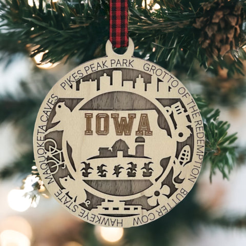 Sprinkle some Hawkeye magic on your tree! Our Iowa State Highlights Ornament is a festive nod to the heartland's beauty. From rolling cornfields to iconic landmarks, celebrate the charm of the Hawkeye State this holiday season.