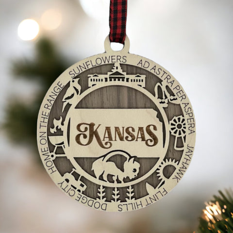 Bring the beauty of the Sunflower State to your holiday tree! Our Kansas State Highlights Ornament captures the essence of the heartland. Elevate your festive decor with the charm of wheat fields and iconic landmarks.