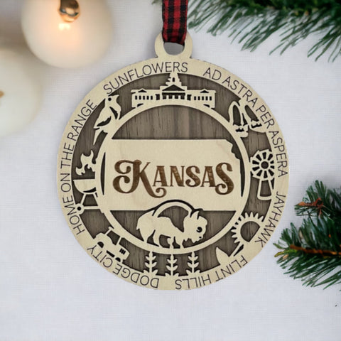 Bring the beauty of the Sunflower State to your holiday tree! Our Kansas State Highlights Ornament captures the essence of the heartland. Elevate your festive decor with the charm of wheat fields and iconic landmarks.