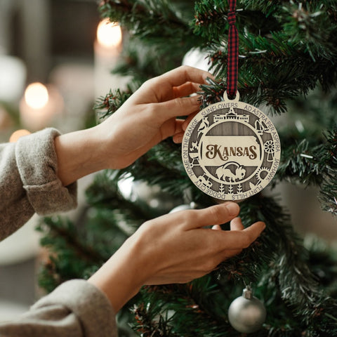 Bring the beauty of the Sunflower State to your holiday tree! Our Kansas State Highlights Ornament captures the essence of the heartland. Elevate your festive decor with the charm of wheat fields and iconic landmarks.