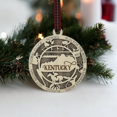 Deck the halls with Bluegrass brilliance! Introducing our Kentucky State Highlights Ornament, a festive tribute to the beauty of the Bluegrass State. From rolling hills to iconic landmarks, add a touch of Kentucky charm to your holiday decor!