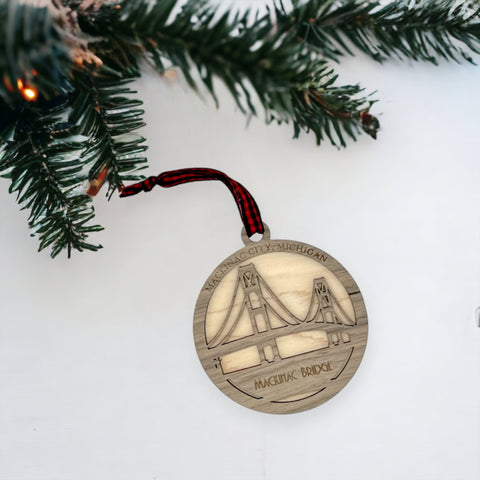 Iconic Mackinac Bridge ornament, featuring the breathtaking steel spans connecting Michigan's Upper and Lower Peninsulas. A majestic addition to your holiday decor, capturing the spirit of this engineering marvel and the beauty of the Great Lakes region.