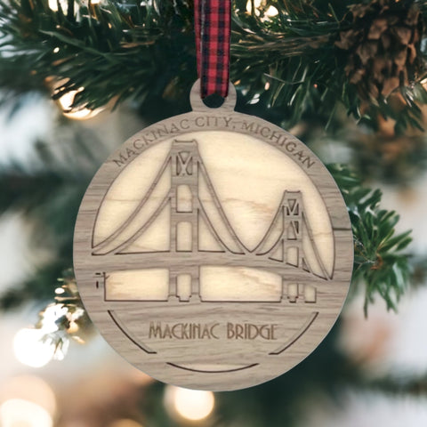 Iconic Mackinac Bridge ornament, featuring the breathtaking steel spans connecting Michigan's Upper and Lower Peninsulas. A majestic addition to your holiday decor, capturing the spirit of this engineering marvel and the beauty of the Great Lakes region.