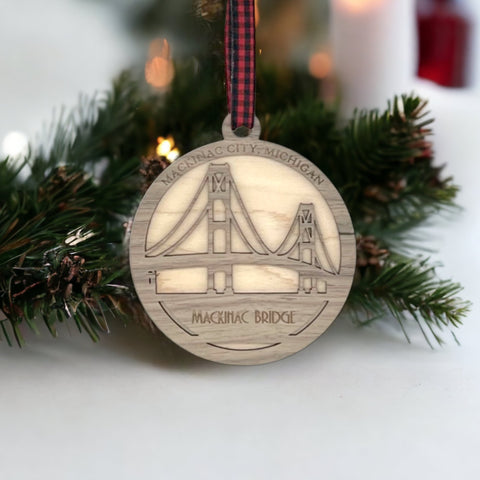 Iconic Mackinac Bridge ornament, featuring the breathtaking steel spans connecting Michigan's Upper and Lower Peninsulas. A majestic addition to your holiday decor, capturing the spirit of this engineering marvel and the beauty of the Great Lakes region.