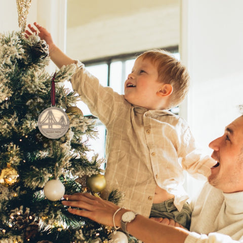 Iconic Mackinac Bridge ornament, featuring the breathtaking steel spans connecting Michigan's Upper and Lower Peninsulas. A majestic addition to your holiday decor, capturing the spirit of this engineering marvel and the beauty of the Great Lakes region.
