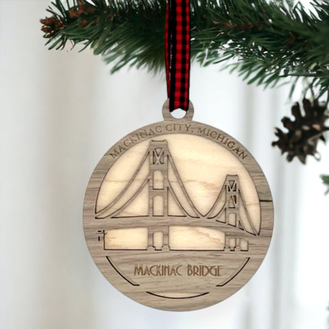 Iconic Mackinac Bridge ornament, featuring the breathtaking steel spans connecting Michigan's Upper and Lower Peninsulas. A majestic addition to your holiday decor, capturing the spirit of this engineering marvel and the beauty of the Great Lakes region.