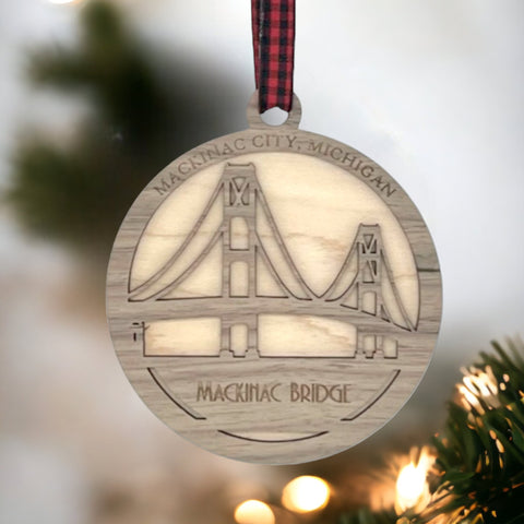 Iconic Mackinac Bridge ornament, featuring the breathtaking steel spans connecting Michigan's Upper and Lower Peninsulas. A majestic addition to your holiday decor, capturing the spirit of this engineering marvel and the beauty of the Great Lakes region.