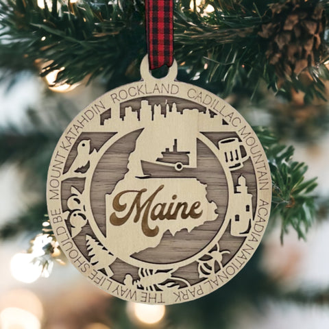 Elevate your holiday with a touch of Maine magic! Introducing our Maine State Highlights Ornament, a coastal-inspired masterpiece. From lighthouses to pine-covered landscapes, celebrate the beauty of the Pine Tree State in every detail.