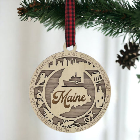 Elevate your holiday with a touch of Maine magic! Introducing our Maine State Highlights Ornament, a coastal-inspired masterpiece. From lighthouses to pine-covered landscapes, celebrate the beauty of the Pine Tree State in every detail.