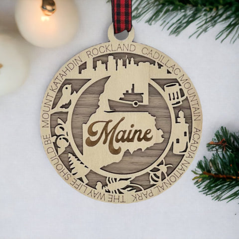 Elevate your holiday with a touch of Maine magic! Introducing our Maine State Highlights Ornament, a coastal-inspired masterpiece. From lighthouses to pine-covered landscapes, celebrate the beauty of the Pine Tree State in every detail.