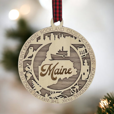 Elevate your holiday with a touch of Maine magic! Introducing our Maine State Highlights Ornament, a coastal-inspired masterpiece. From lighthouses to pine-covered landscapes, celebrate the beauty of the Pine Tree State in every detail.