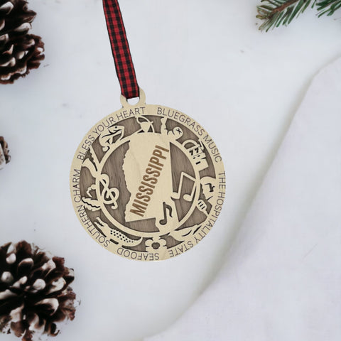 Dazzle your tree with Mississippi magic! Our Highlights Ornament captures the soul of the Magnolia State in every detail. Elevate your holiday with Southern charm and iconic moments.