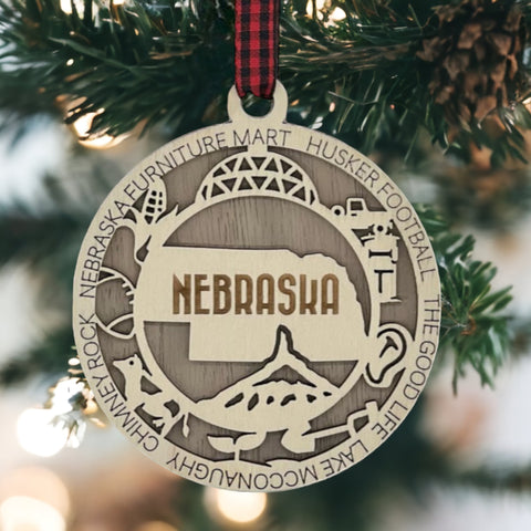 Deck your tree with a dash of Cornhusker pride! Our Nebraska State Highlights Ornament celebrates iconic moments in the heart of the Midwest.