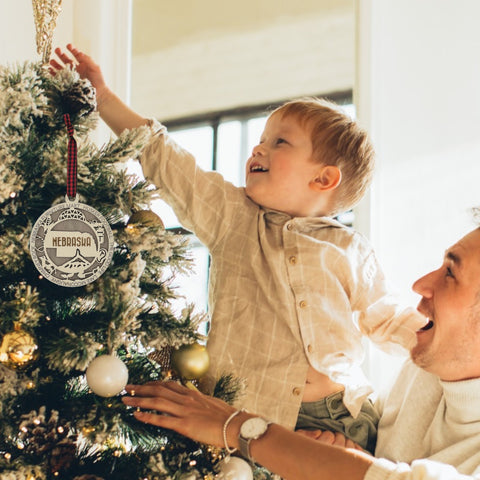 Deck your tree with a dash of Cornhusker pride! Our Nebraska State Highlights Ornament celebrates iconic moments in the heart of the Midwest.
