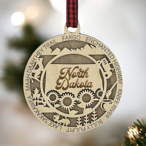 Discover the charm of the Peace Garden State! Introducing the North Dakota State Highlights Ornament—a petite masterpiece capturing the beauty of the Midwest. Elevate your holiday decor with a touch of North Dakota magic.