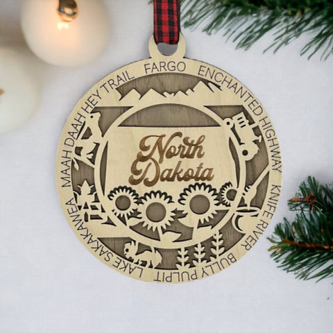 Discover the charm of the Peace Garden State! Introducing the North Dakota State Highlights Ornament—a petite masterpiece capturing the beauty of the Midwest. Elevate your holiday decor with a touch of North Dakota magic.