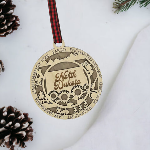 Discover the charm of the Peace Garden State! Introducing the North Dakota State Highlights Ornament—a petite masterpiece capturing the beauty of the Midwest. Elevate your holiday decor with a touch of North Dakota magic.