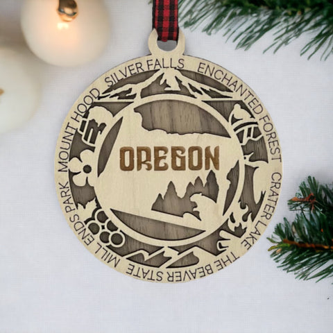Oregon dreams on your tree! Introducing the Oregon State Highlights Ornament—a mini masterpiece capturing the beauty of the Pacific Northwest. Elevate your holiday decor with a touch of Oregonian magic. Embrace the spirit of the Beaver State this festive season!