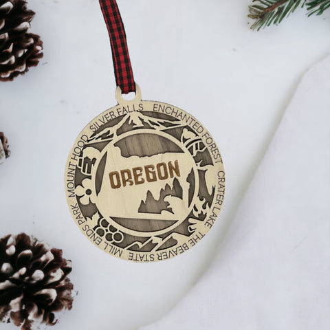 Oregon dreams on your tree! Introducing the Oregon State Highlights Ornament—a mini masterpiece capturing the beauty of the Pacific Northwest. Elevate your holiday decor with a touch of Oregonian magic. Embrace the spirit of the Beaver State this festive season!