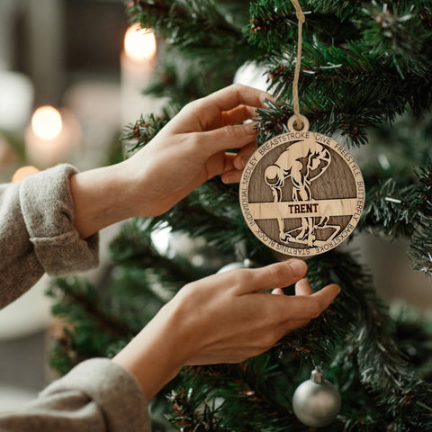 Dive into holiday joy with our Personalized Male Swimmer Ornament! Crafted for aquatic enthusiasts, this custom keepsake adds a personal touch to your tree. Celebrate the swimmer in your life with this spirited ornament. Customize now for a splash of festivity in holiday decor – order your Personalized Male Swimmer Ornament today!