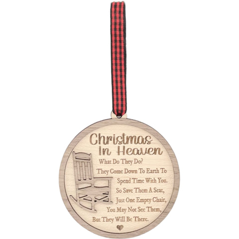 Officially licensed Christmas in Heaven memorial wooden ornament by John F Connor, featuring a poignant chair design with the iconic 'Christmas in Heaven' poem. A heartfelt remembrance gift for the holiday season, this maple and walnut ornament can be personalized on the back with any name or phrase. Versatile for use as a tree ornament or a year-round display, it serves as a touching sympathy gift, preserving cherished memories with enduring grace.