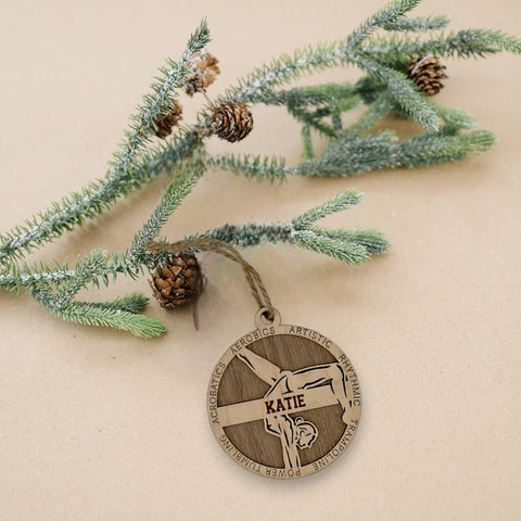 Sparkle and flip into the holiday season with our Personalized Female Gymnast Ornament! Crafted for gymnastics enthusiasts, this custom keepsake adds a personal touch to your tree. Celebrate the grace and strength of your gymnast with this spirited ornament. Customize now for a dazzling touch in holiday decor – order your Personalized Female Gymnast Ornament today!