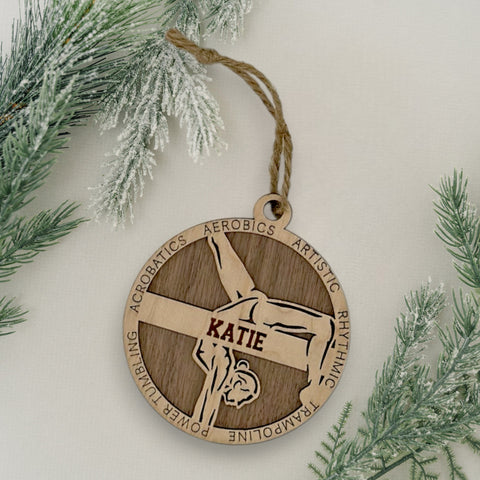 Sparkle and flip into the holiday season with our Personalized Female Gymnast Ornament! Crafted for gymnastics enthusiasts, this custom keepsake adds a personal touch to your tree. Celebrate the grace and strength of your gymnast with this spirited ornament. Customize now for a dazzling touch in holiday decor – order your Personalized Female Gymnast Ornament today!