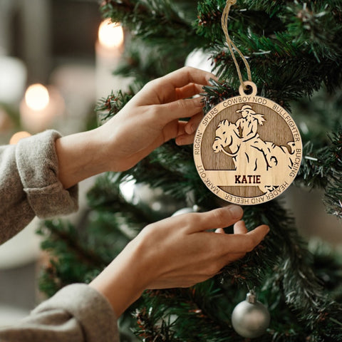 Embrace the wild west with our Personalized Female Rodeo Ornament! Tailored for rodeo enthusiasts, this custom keepsake adds a personal touch to your tree. Celebrate the cowgirl in your life with this spirited ornament. Customize now for a rodeo-ready touch in holiday decor – order your Personalized Female Rodeo Ornament today!