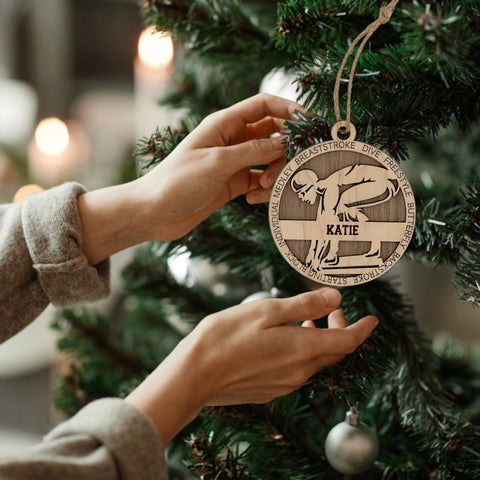 Make a splash in holiday celebrations with our Personalized Female Swimmer Ornament! Designed for aquatic enthusiasts, this custom keepsake adds a personal touch to your tree. Celebrate the swimmer in your life with this spirited ornament. Customize now for a wave of festivity in holiday decor – order your Personalized Female Swimmer Ornament today!