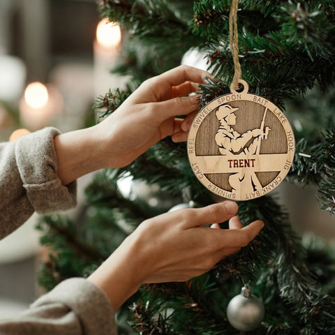 Reel in the holiday joy with our Personalized Male Fishing Ornament! Crafted for fishing enthusiasts, this custom keepsake adds a personal touch to your tree. Celebrate the catch and passion of your angler with this spirited ornament. Customize now for a reel-y unique touch in holiday decor – order your Personalized Male Fishing Ornament today!